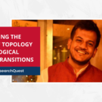 Smiling man in a red vest beside text: "Exploring the Role of Topology in Biological Phase Transitions".