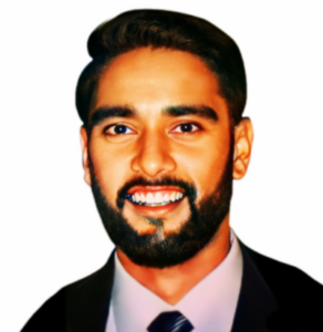 Smiling man with a beard, wearing a suit and tie, against a white background.
