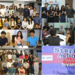 Group of people at a startup event with speakers, discussions, and a banner reading "Startup Ashoka".