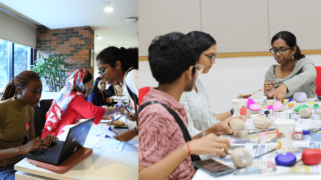 Resident assistants facilitating painting and craft activities for students.
